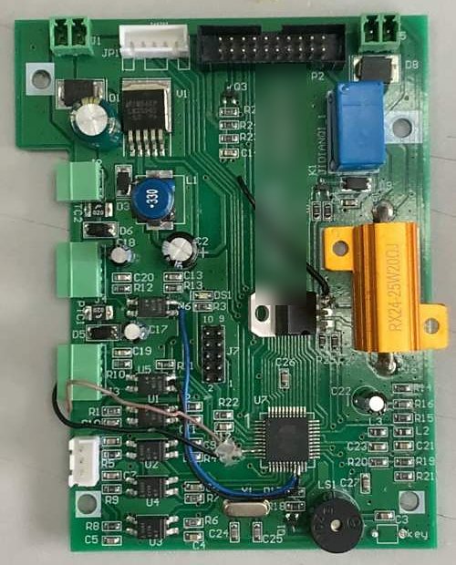 Green control board with hand-soldered jumper wires added during rework